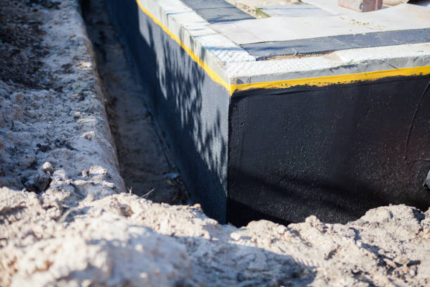 Professional Emergency Waterproofing technician working in Clayton, MI